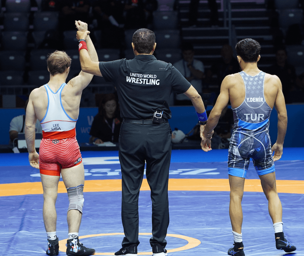 Spencer Lee getting his hand raised at the World Championships.
